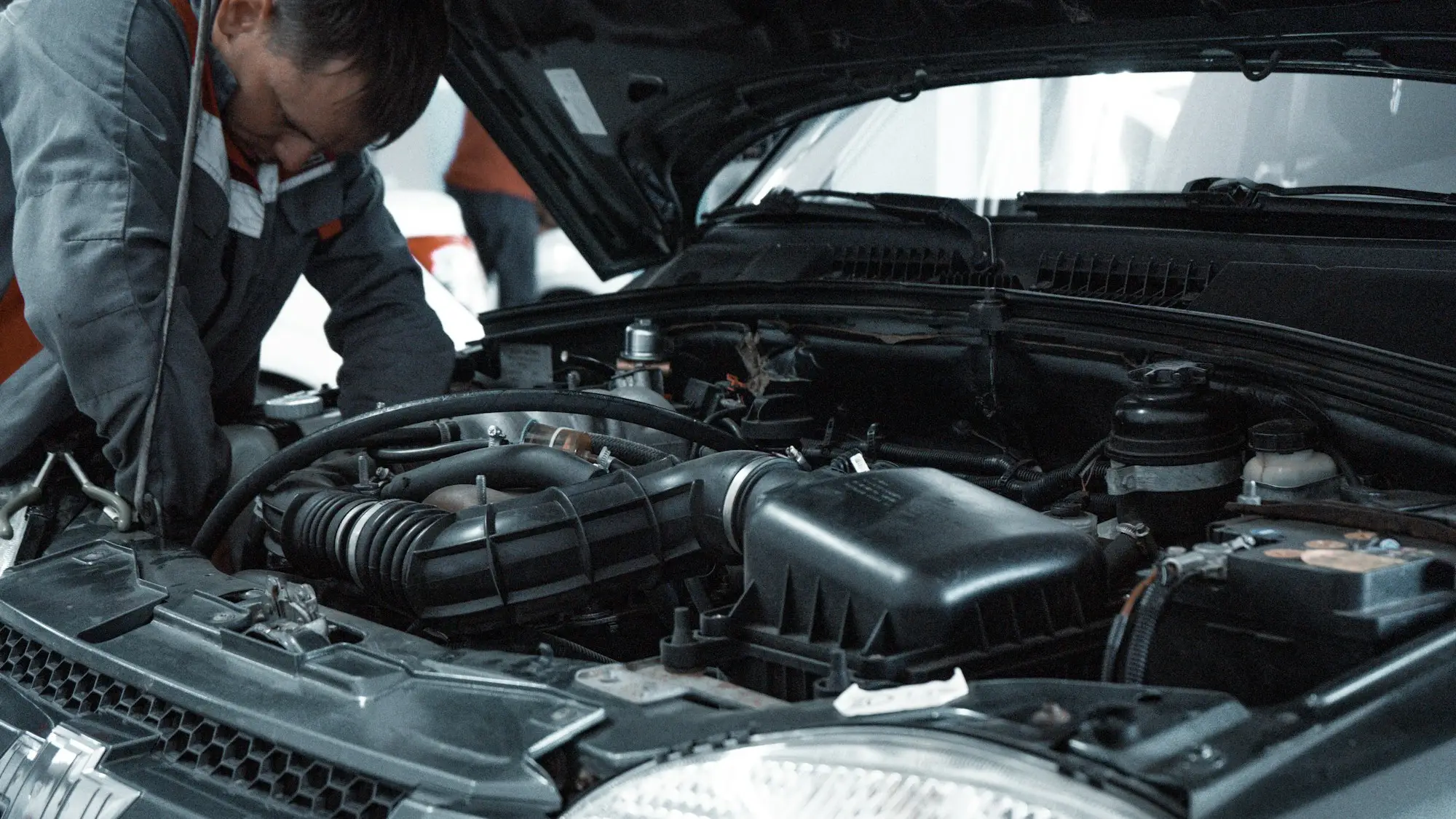 Mechanic inspecting a car engine bay during a service, Brother Mechanics Greenford